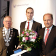Photo of Andreas Thies receiving an award
